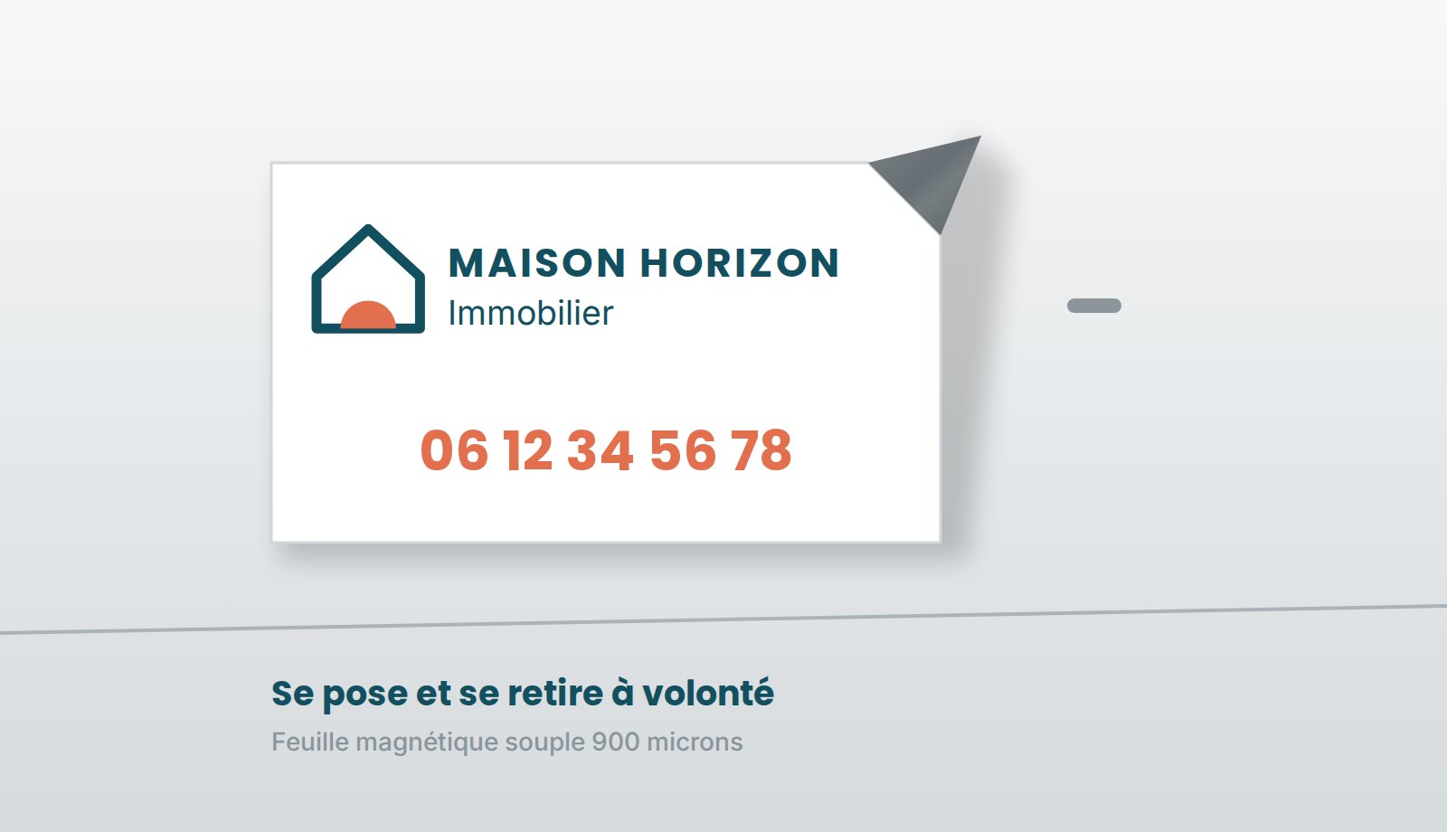 Main décollant le coin d'une plaque magnétique souple